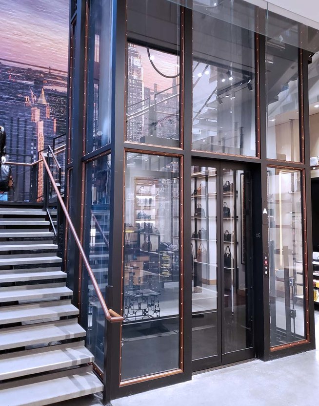 Coach integrated brand elements into their custom glass elevator