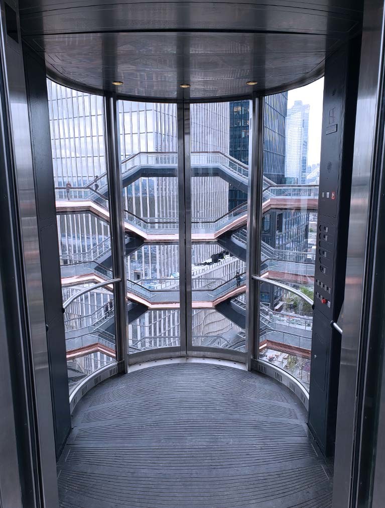 The Vessel at Hudson Yards Elevators internal view with glass walls and stainless steel cladding