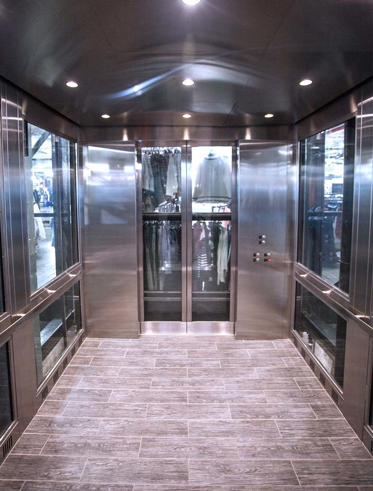 850 Third Ave, Brooklyn, glass elevator cab interior with stainless steel & glass paneled walls