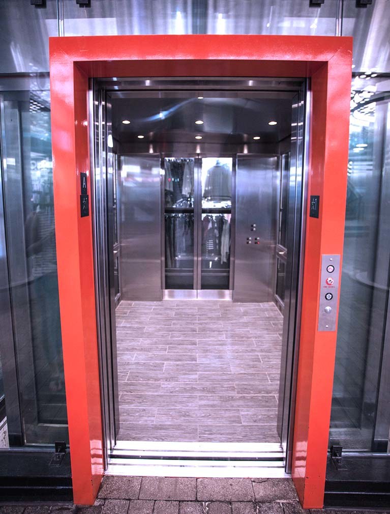 Custom Elevator Installation glass and stainless steel